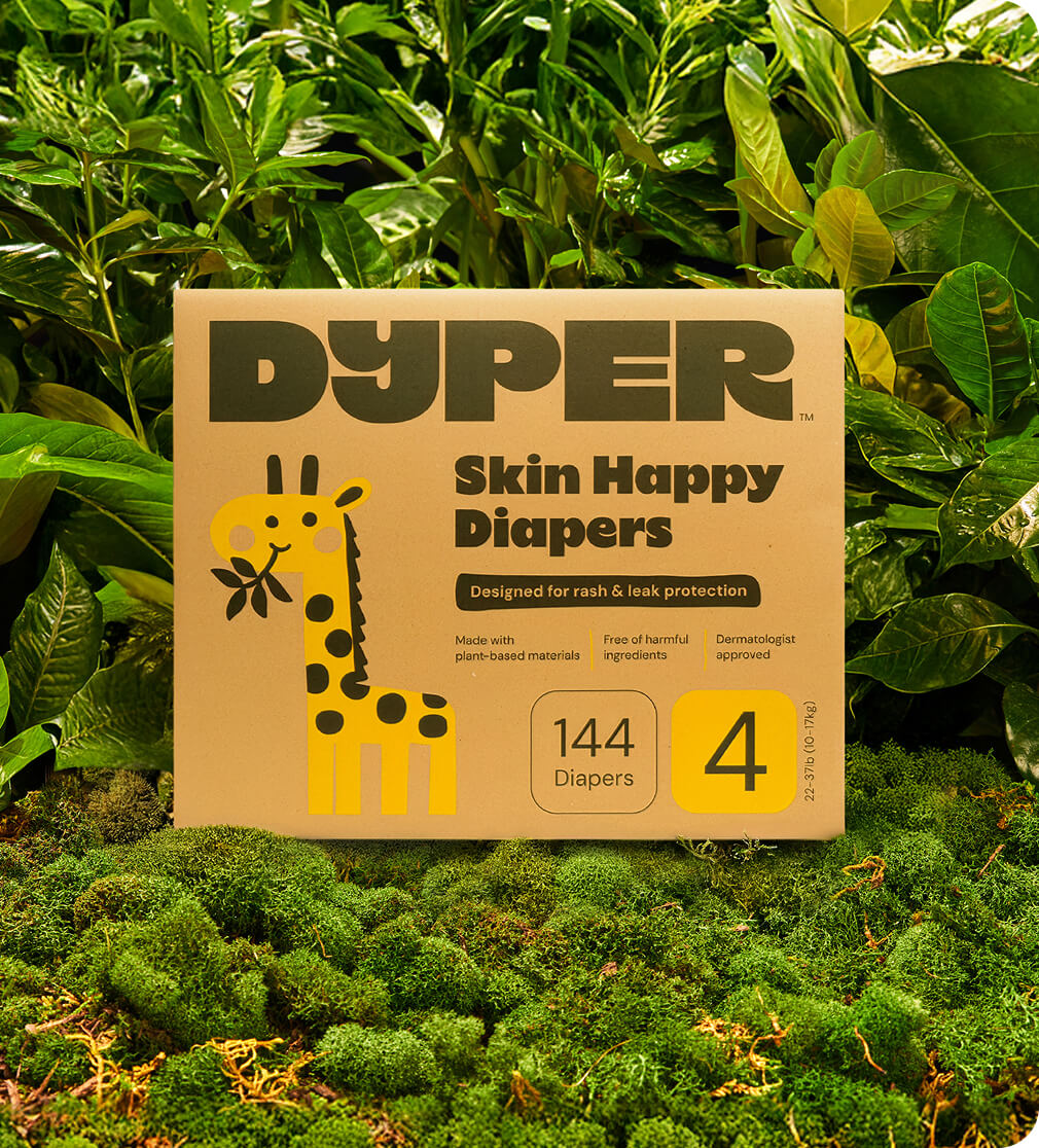 A box of Dyper Skin Happy Diapers in greenery